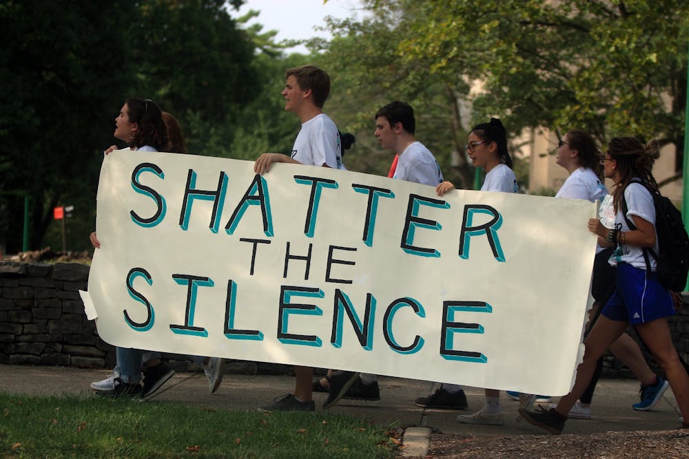 <p>IU students hold a sign that reads “Shatter the Silence” on Aug. 18, 2018, in front of fraternity houses on East Third Street. Shatter the Silence will now operate as a community organization instead of as a student organization.</p>