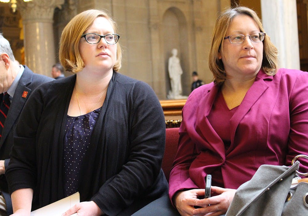 Jimmanee Gomez-Spears talks with Leslie Barnes of the Indiana National Organization for Women Wednesday outside room 431 at the Indianapolis Statehouse. The two women came to the Statehouse Wednesday morning to testify against House Bill 1337. 