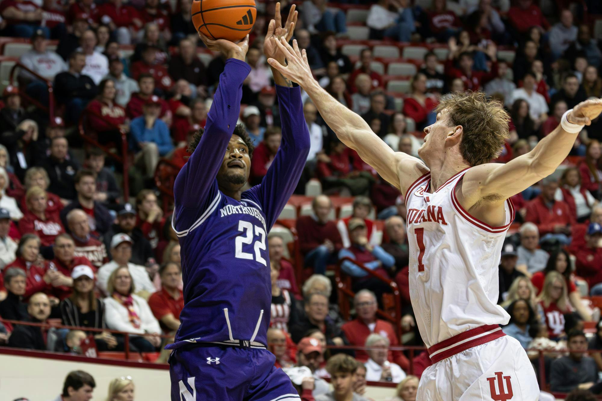 Indiana senior Reed Bailey blocks Northwestern's shot during their game on Feb. 24, 2026, at Simon Skjodt Assembly Hall in Bloomington. Bailey had two assists during the game. 