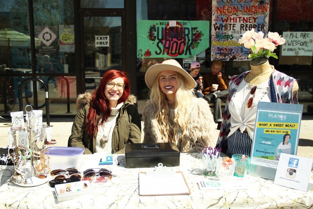 Tasha Parson, left, and Mary Grace Jackson from Plato’s Closet a a vendor booth Saturday at Culture Shock.