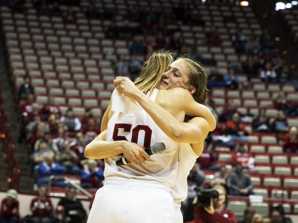 Junior Ali Patberg embraces senior Brenna Wise after giving a speech Feb. 27 in Simon Skjodt Assembly Hall. No. 22 IU beat Nebraska 81-53, Wise was honored as the only senior on the team.