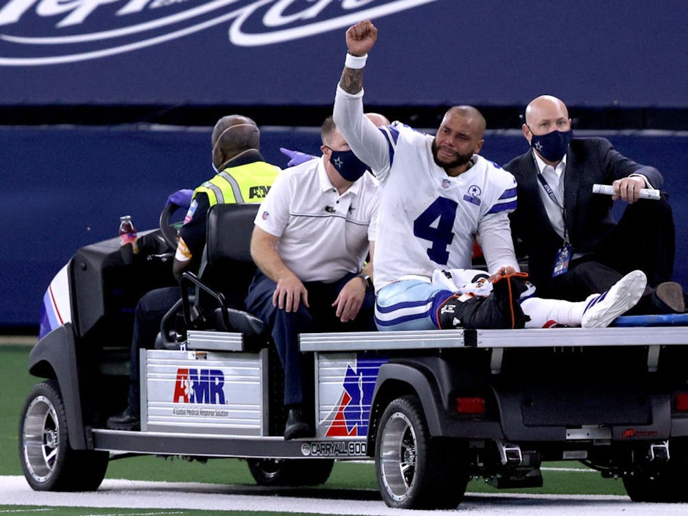 Dak Prescott is carted off the field after sustaining a leg injury against the New York Giants Oct. 11, 2020, at AT&amp;T Stadium in Arlington, Texas.