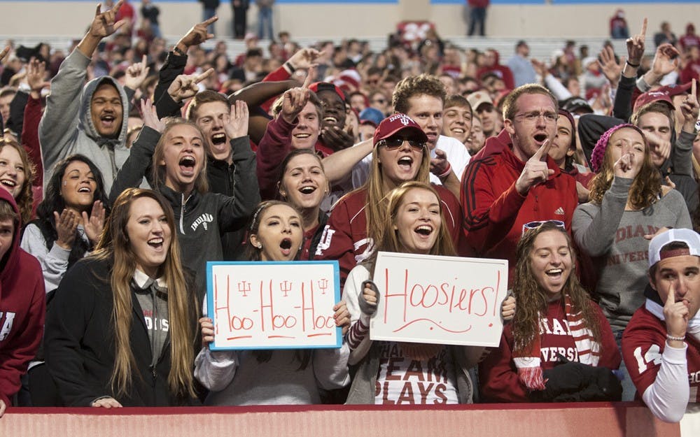 Students cheer on the Hoosiers during the game against Iowa on Saturday at Memorial Stadium. The Hoosiers lost, 27-35.