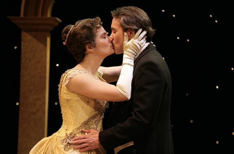 Graduate students Sara Fischer, as Lady Chiltern, and Eric Young, as Lord Chiltern rehearse a scene from "An Ideal Husband" Monday evening at the Ruth N. Halls Theatre. The play is presented as part of IU's 25th annual ArtsWeek by the Department of Theatre and Drama.