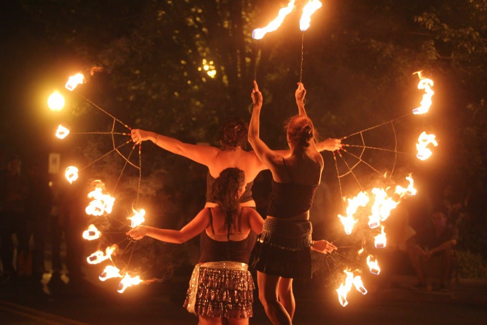 <p>Kali-Ma Fire Troupe of Bloomington dances in the middle of Kirkwood Avenue during Lotus Festival in 2010.&nbsp;</p>