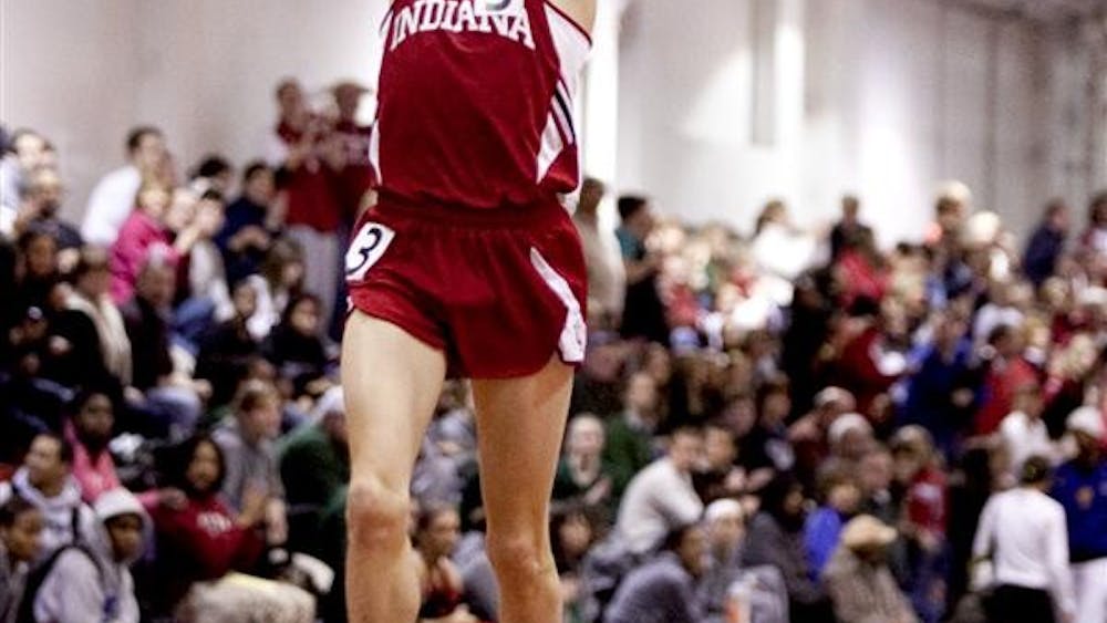 Sophomore Andy Bayer celebrates setting IU's 3000 meter record in 7:48.35 on Jan. 21 during the Gladstein Invitational held indoors at the Gladstein Field House. Bayer is the first track runner to be an Academic All-American in IU history.