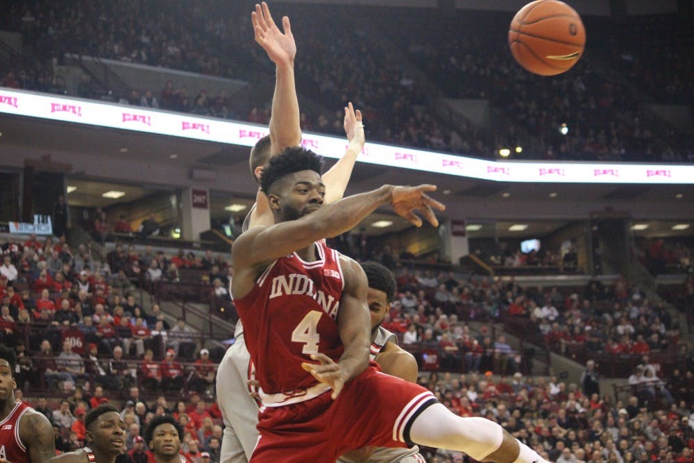 Junior guard Robert Johnson passes the ball after attacking the hoop. Johnson had 26 points, six rebounds and six assists.&nbsp;IU had five steals in the game bringing the Hoosiers to a 96-92 victory over Ohio State.
