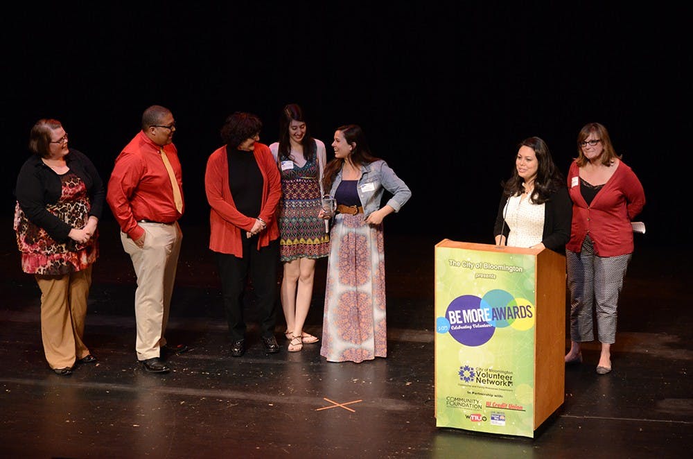 Eigenmann Hall residents accept the Be More Involved Award at the Buskirk-Chumley Theater on Tuesday for their work with the South Central Community Action Program. Eigenmann Hall residents have been working with the program for 7 years to help low-income citizens to move toward personal and economic independence, according to the event program.