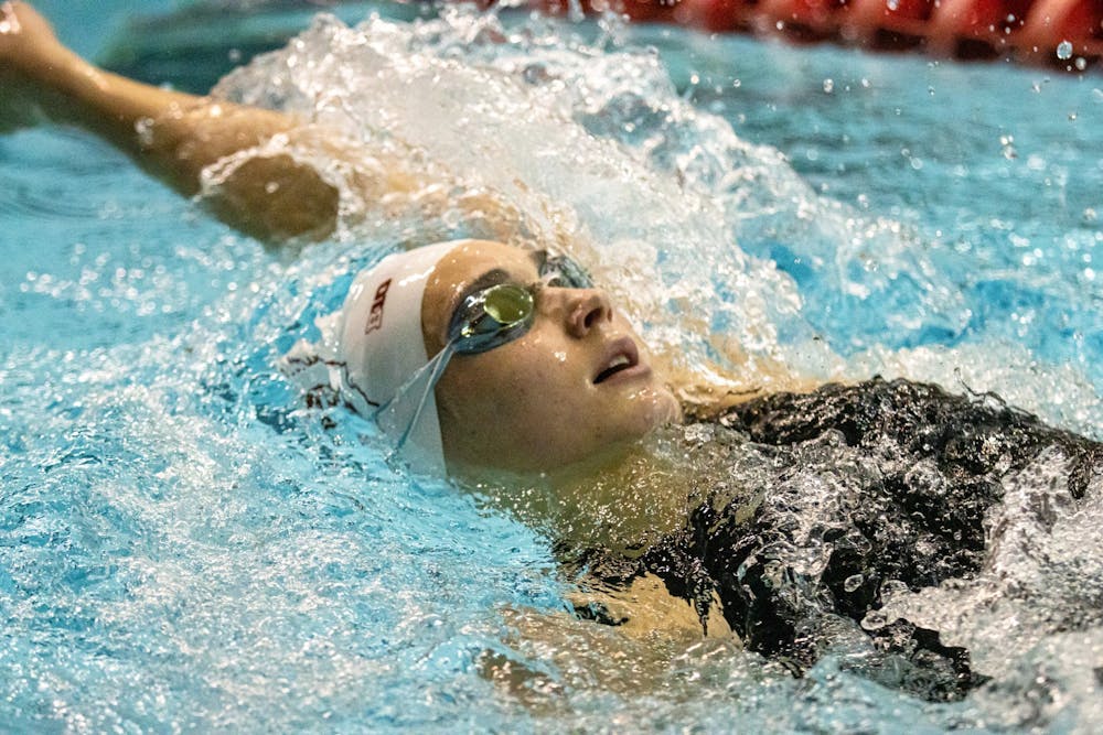 <p>An Indiana swimmer competes in backstroke during a duel meet against University of Cincinnati on Dec. 3, 2021, in the Counsilman-Billingsley Aquatic Center. IU Men and Women&#x27;s Swim and Dive team will face the University of Louisville at 2 p.m. on Jan. 14, 2022, in the Counsilman-Billingsley Aquatic Center. </p>