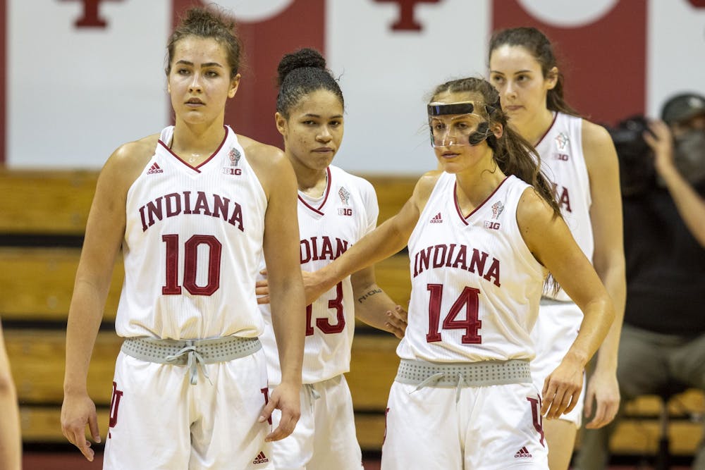 <p>Senior Ali Patberg, juniors Jaelynn Penn and Aleksa Gulbe and sophomore Mackenzie Holmes break from a huddle Dec. 20 at Simon Skjodt Assembly Hall. No. 15 IU defeated the Nebraska Cornhuskers 81-45 in the first Big Ten game of the season.</p>