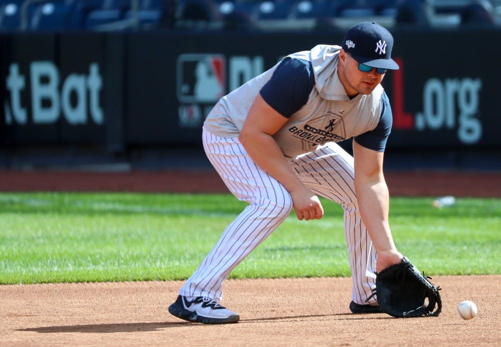 New York Yankees first baseman Luke Voit catches a ground ball Oct. 10. 