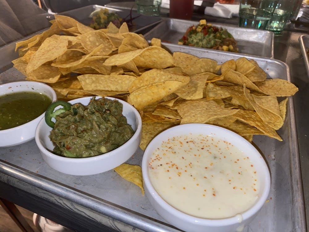 A chips and salsa flight from Social Cantina appears Wednesday. The flight includes a choice between two salsas and either white-cheese queso, guacamole or Cali-guacomole, which is topped with pico de gallo. 