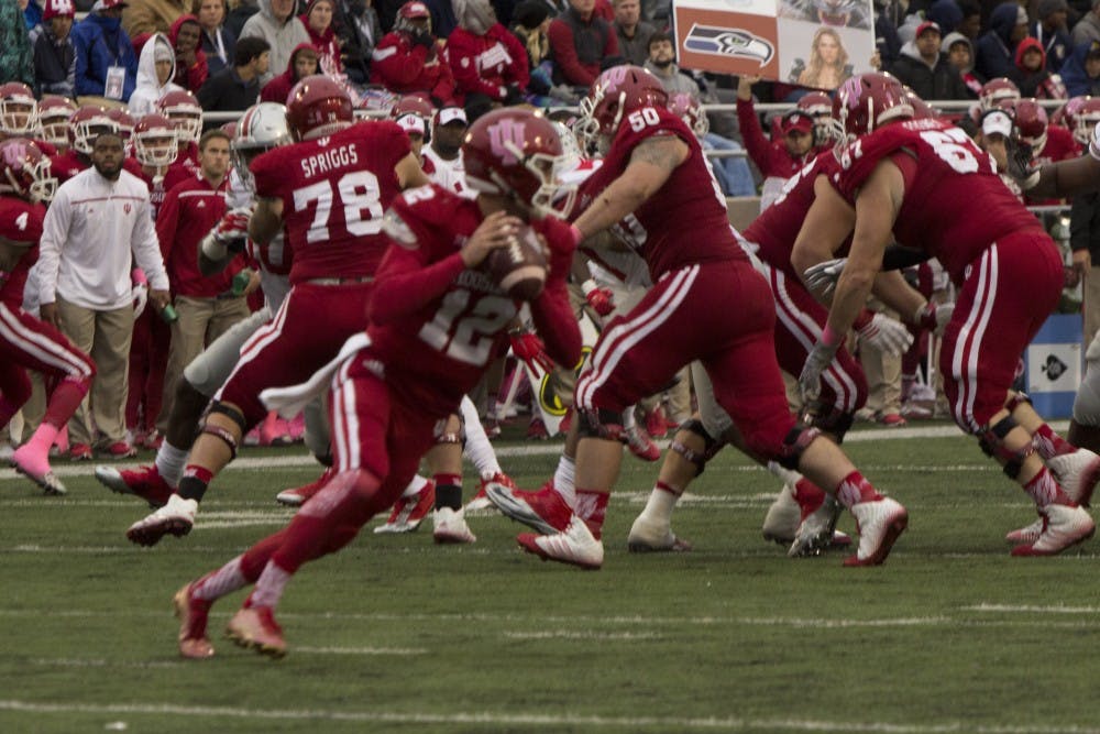 Quarterback Zander Diamont looks to pass the ball in the fourth quarter of play against Ohio State on Saturday at Memorial Stadium. Diamont rushed 98 yards and scored a touchdown in the second half of the game.