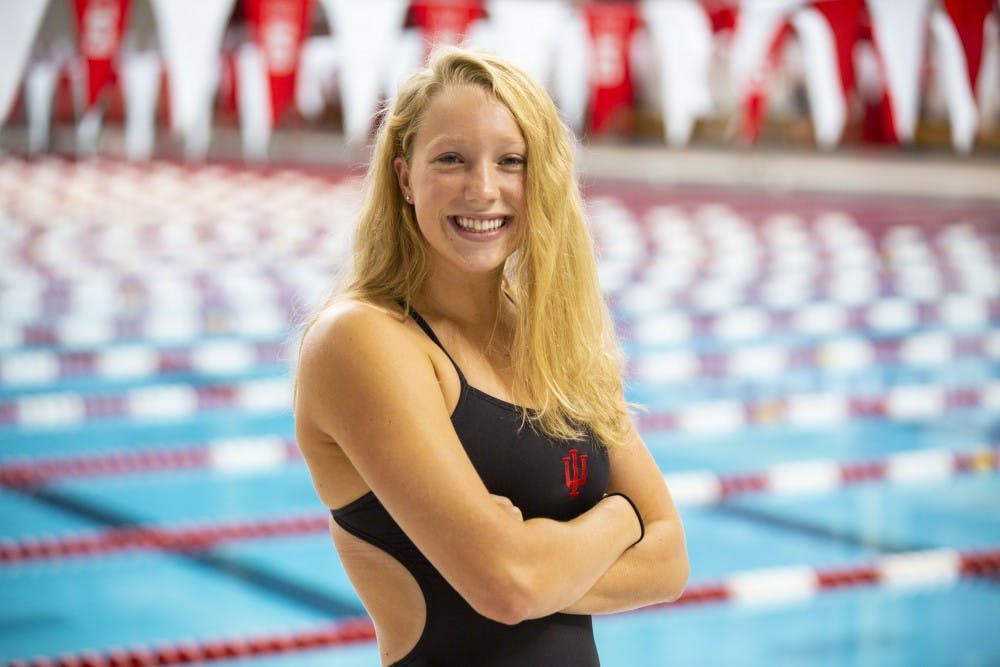<p>Freshman Mackenzie Looze poses for a photo before practice Sept. 18 in the Counsilman Billingsley Aquatic Center. Looze's father is the current head coach of IU swimming and diving.</p>