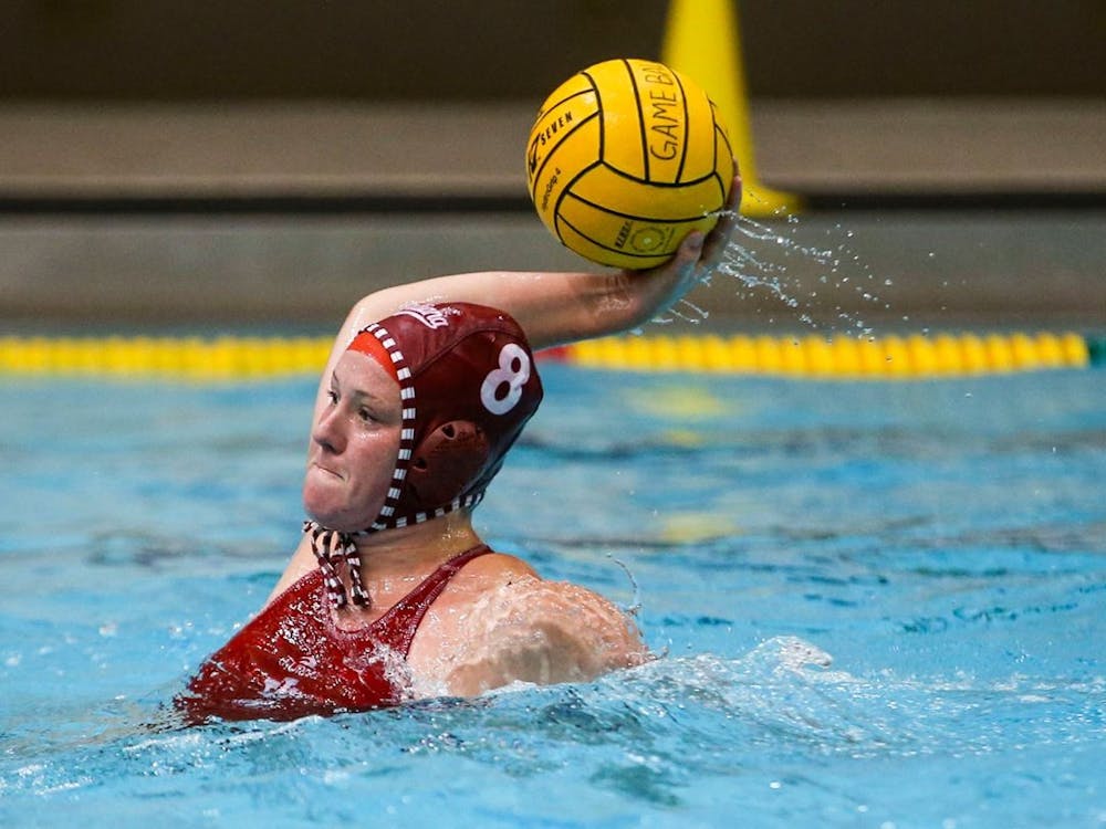 Then-junior center Izzy Mandema makes a pass April 2, 2021, at the Counsilman-Billingsley Aquatic Center. Mandema discovered she needed elbow surgery in 2020 at the beginning of her sophomore season, and used time she had off during the COVID-19 pandemic to recover from the surgery.
