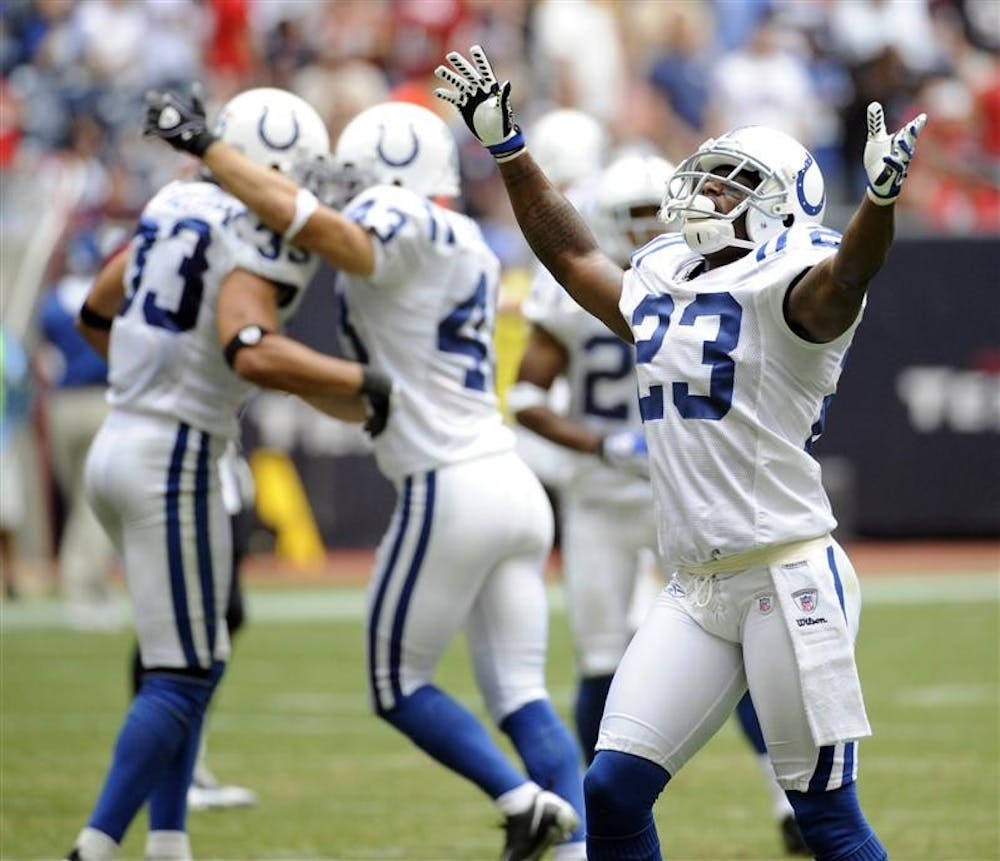 Indianapolis Colts defensive back Tim Jennings (23) celebrates after teammate Melvin Bullitt (33) intercepted a pass during the fourth quarter of an NFL football game on Sunday in Houston. Celebrating with Bullitt is Matt Giordano (43). The Colts beat the Texans 31-27. 