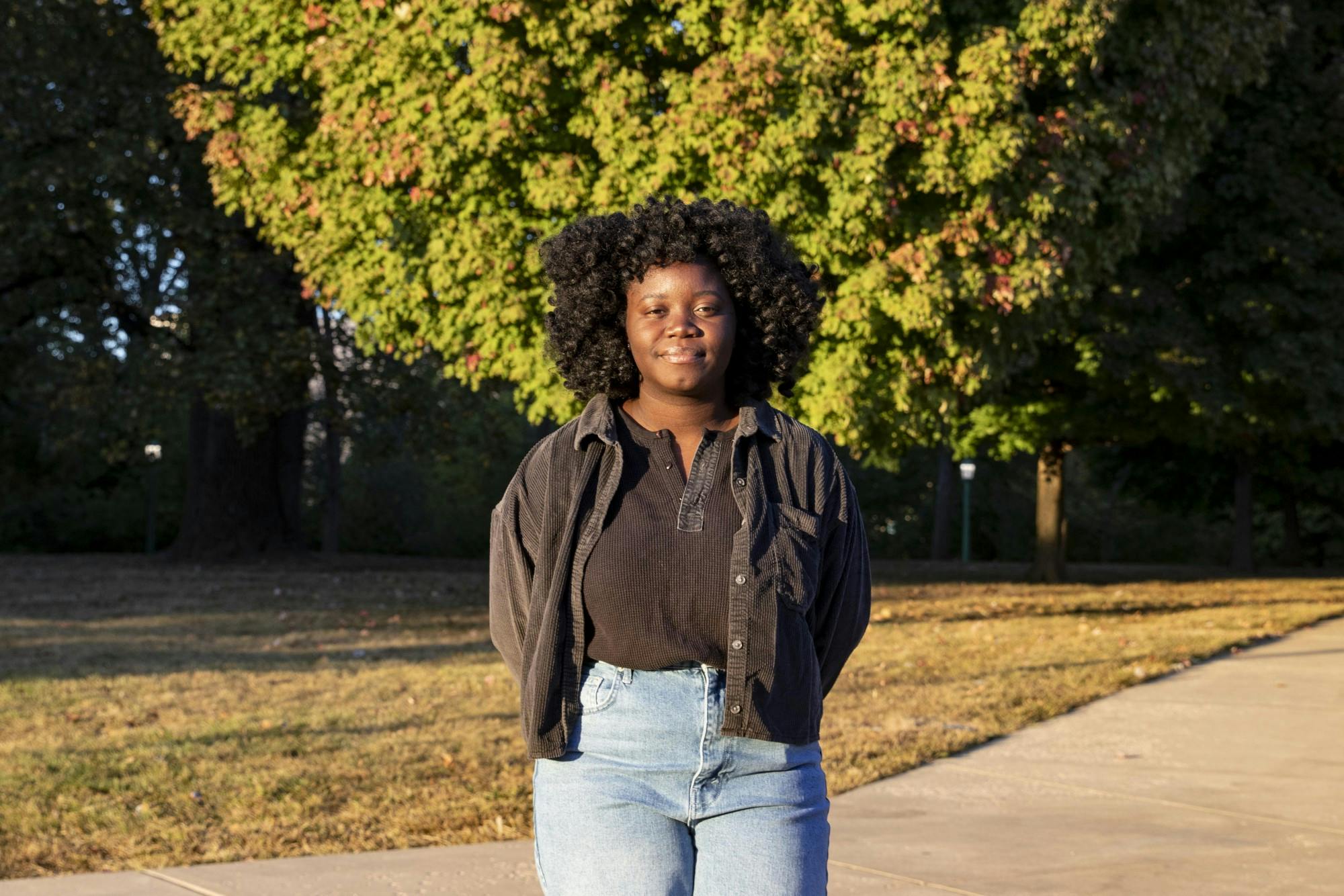 Junior Massa Massa Massaley stands in the sun Oct. 5﻿in Bloomington, Indiana. Massaley is a Black student at IU and has experienced acts of bias alongside her best friend Alice Aluko.