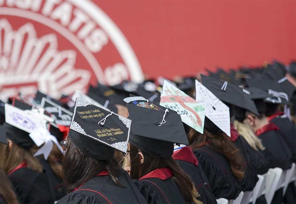 Graduates wear DIY graudation cap during Spring 2016 Undergraduate Commencement Ceremony on Saturday morning at Memorial Stadium. 