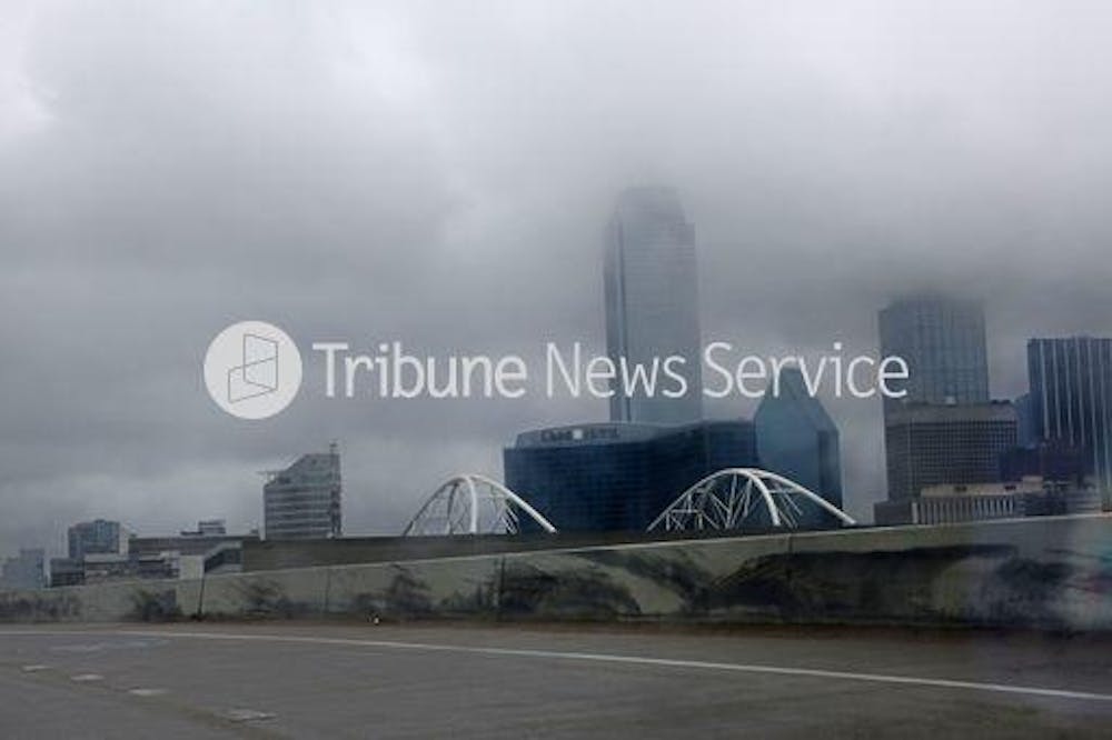An image of a cloudy city with the words Tribune News Service written in the foreground