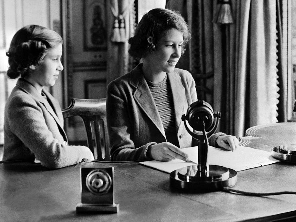 A picture taken in October 1940 shows the Britain's Princess Elizabeth, future Queen Elizabeth II, and her sister, Princess Margaret, left, in Windsor, sending a message during the BBC's children program, particularly to the children who were being evacuated because of the World War II.