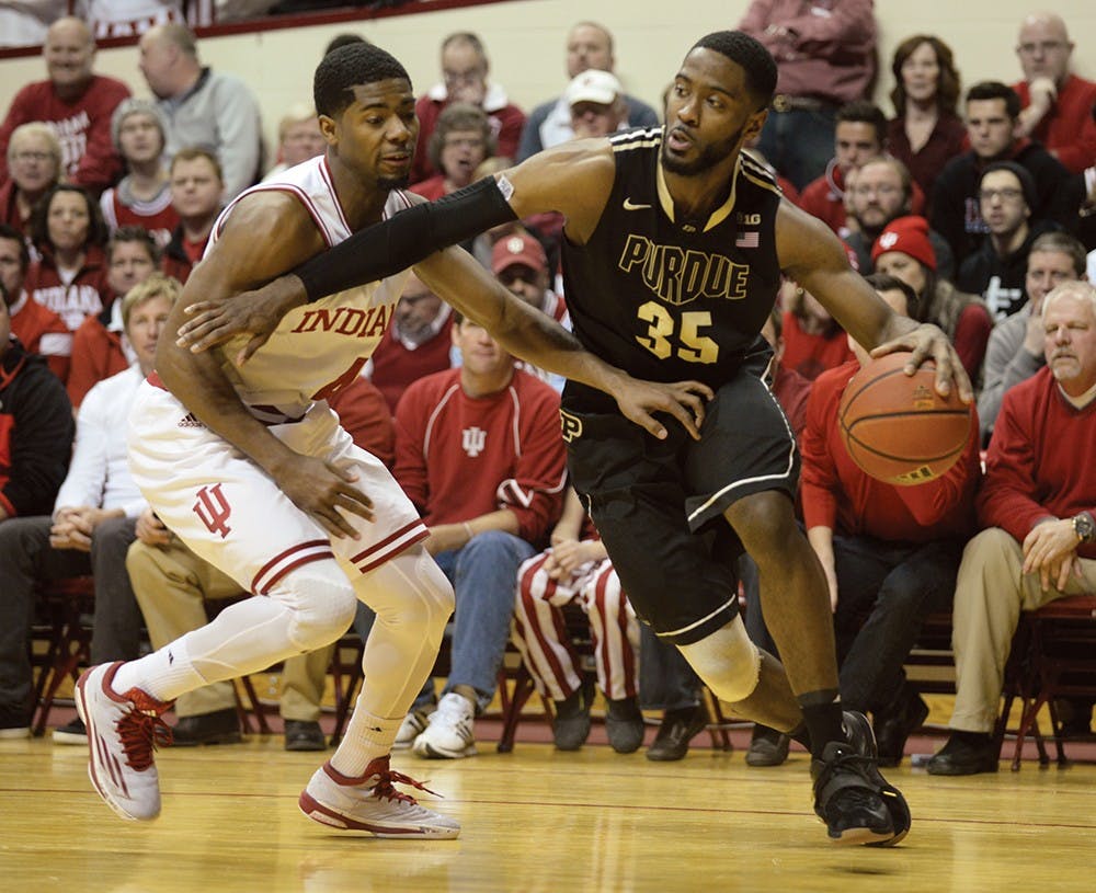 Sophomore guard Robert Johnson defends Purdue guard Rapheal Davis in a 67-63 loss Wednesday to Purdue. Johnson finished two points on 1-of-8 shooting. 
