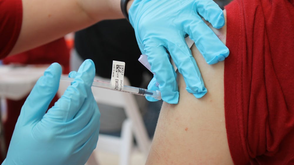 Then-junior Bryce Asher receives a COVID-19 vaccination April 12, 2021, at Simon Skjodt Assembly Hall. The Indiana Department of Health’s latest influenza update, covering the week of March 12, 2023, reflected low levels of influenza-like illness statewide.  