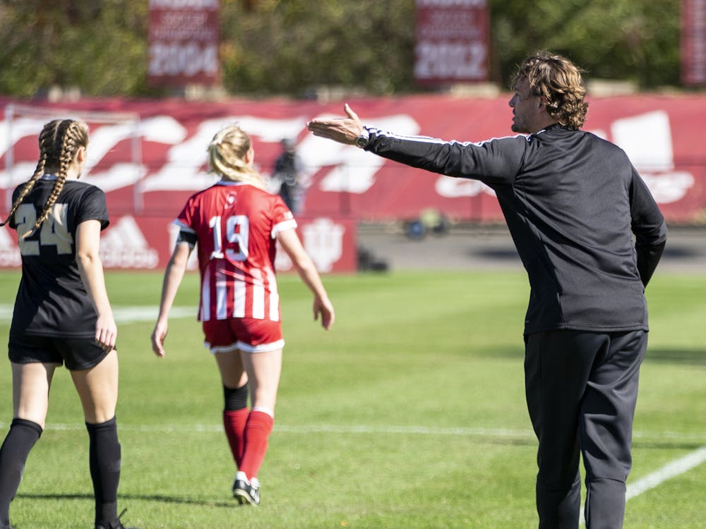 Indiana women's soccer head ﻿coach Erwin van Bennekom gives advice to a player Oct. 27, 2019, at Bill Armstrong Stadium. Indiana will face Morehead State Thursday night