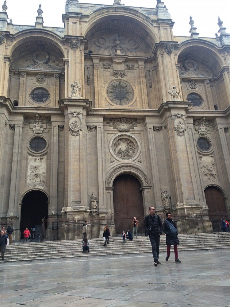 Visitors walk in front of la Catedral in Granada, Spain. The church is one of the area's top tourist attractions.
