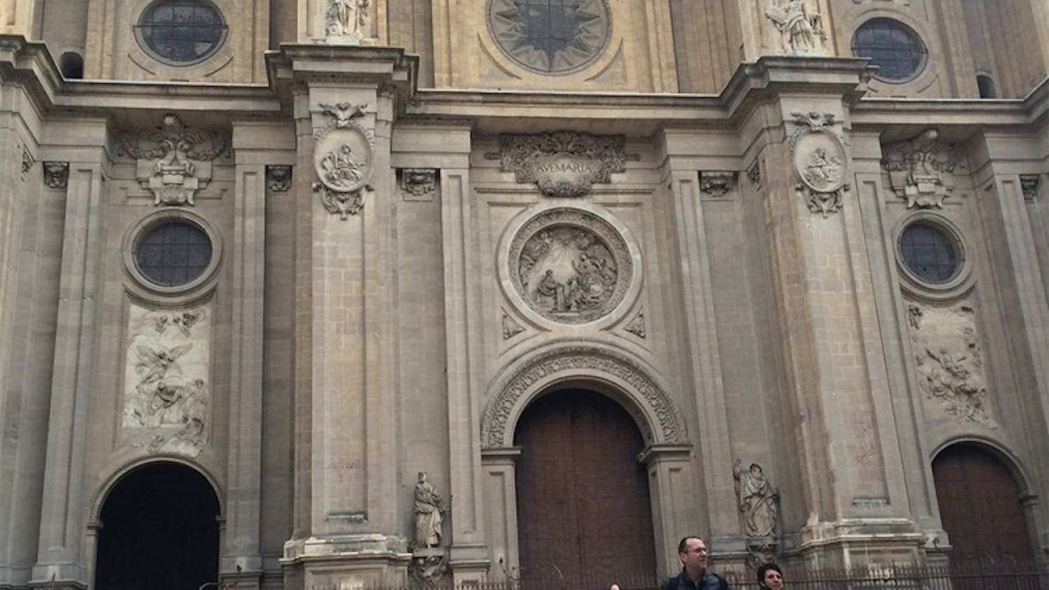 Visitors walk in front of la Catedral in Granada, Spain. The church is one of the area's top tourist attractions.