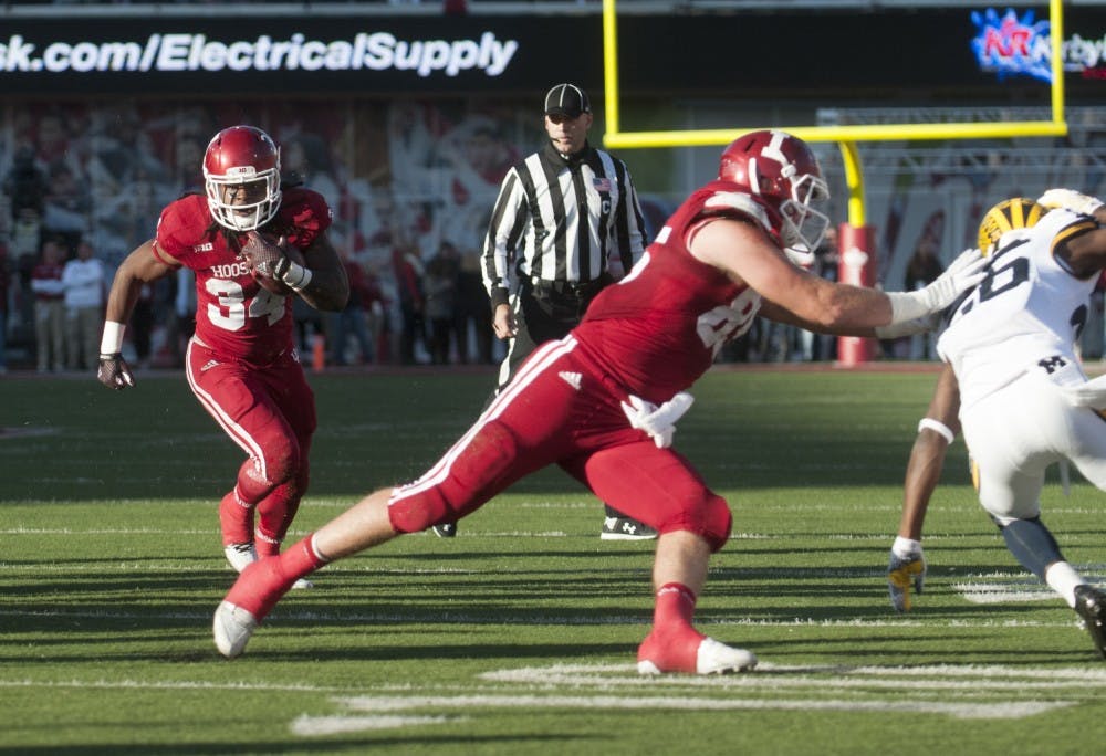Running back Devine Redding runs towards the end zone during the against Michigan on Saturday at Memorial Stadium. The Hoosiers lost in double overtime, 41-48.