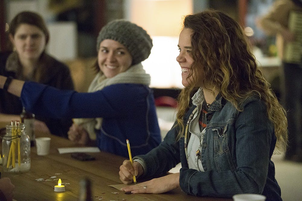 Chelsea Sanders tries blind painting in Blueline Gallery on Friday night.