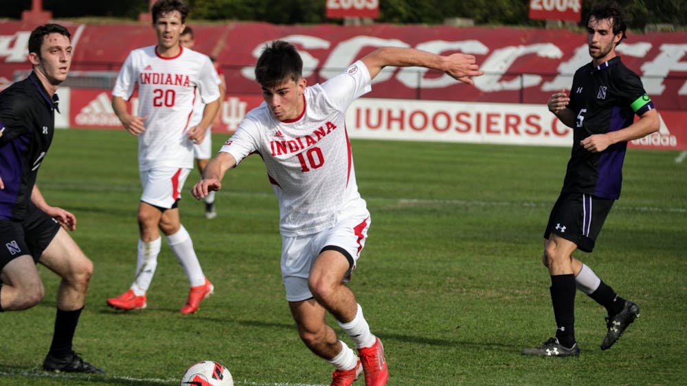 Freshman forward Tommy Mihalic posseses the ball in a game against Northwestern on Nov. 10, 2021, at Bill Armstrong Stadium. IU announced in a press release that three of the October games have been rescheduled.