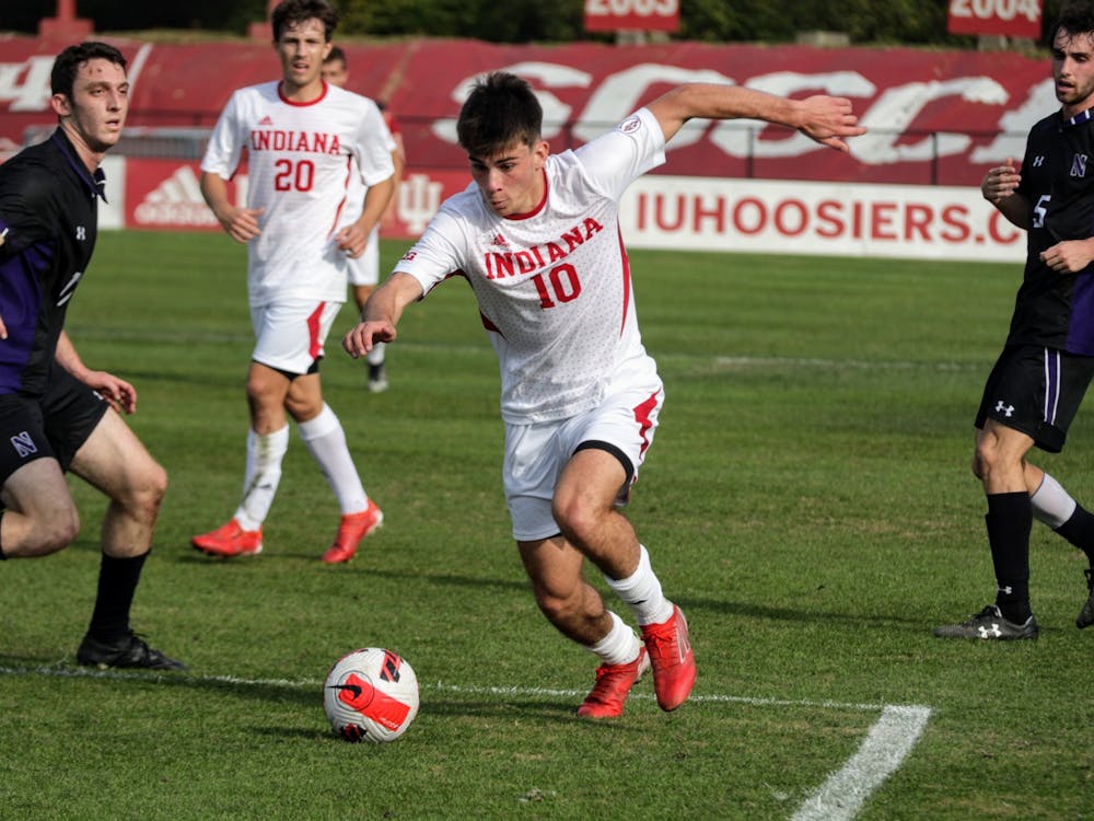 Freshman forward Tommy Mihalic posseses the ball in a game against Northwestern on Nov. 10, 2021, at Bill Armstrong Stadium. IU announced in a press release that three of the October games have been rescheduled.