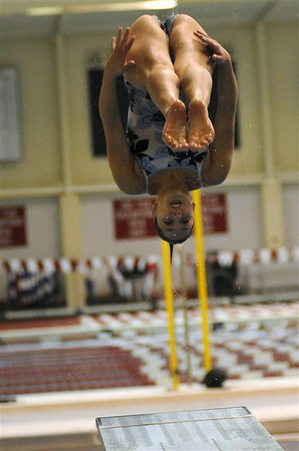 IU senior diver Christina Loukas practices a dive off of a one-meter springboard during a practice Feb. 26 at the Counsilman-Billingsley Aquatic Center. Loukas was recently selected to the USA Diving 2009 World Championships team.