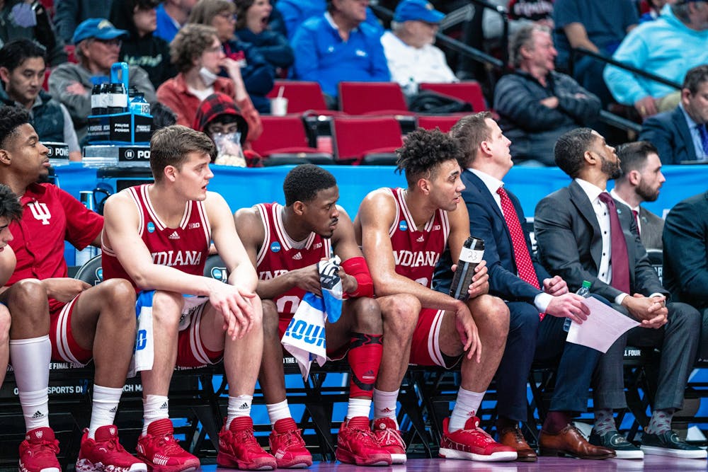 <p>Indiana men&#x27;s basketball players Miller Kopp, Xavier Johnson, and Trayce Jackson-Davis watch the game slip away Mar. 17, 2022, at the Moda Center in Portland, OR. The Hoosiers defeated Xavier 81-79 in Cincinnati on Friday.</p>