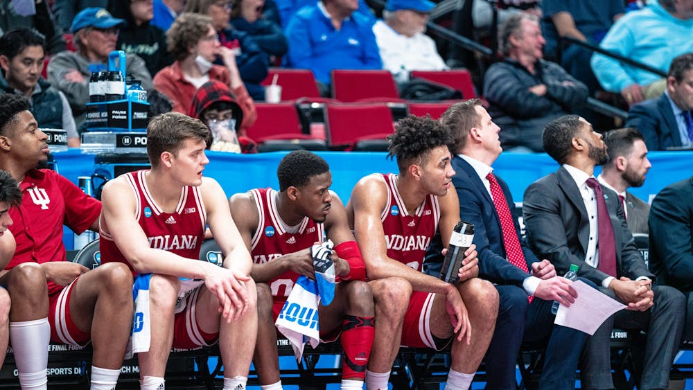 Indiana men&#x27;s basketball players Miller Kopp, Xavier Johnson, and Trayce Jackson-Davis watch the game slip away Mar. 17, 2022, at the Moda Center in Portland, OR. The Hoosiers defeated Xavier 81-79 in Cincinnati on Friday.