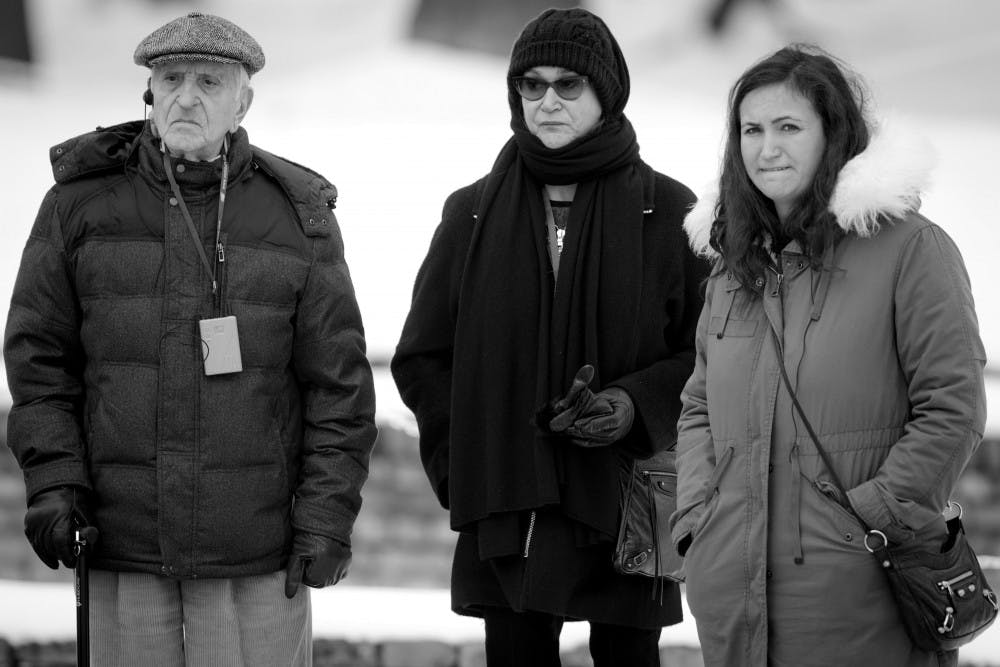 Cynthia Simon-Skjodt, center, and daughter Samantha Skjodt stand with Holocaust survivor Henry Greenbaum in Poland at a delegation ceremony for the United States Holocaust Memorial Museum. Simon-Skjodt is one of the founders of the Samerian Foundation of Indianapolis, which donated $20 million to the United States Holocaust Memorial Museum and also $40 million to the renovation of Assembly Hall, which is to be renamed the Simon-Skjodt Assembly Hall on completion. 