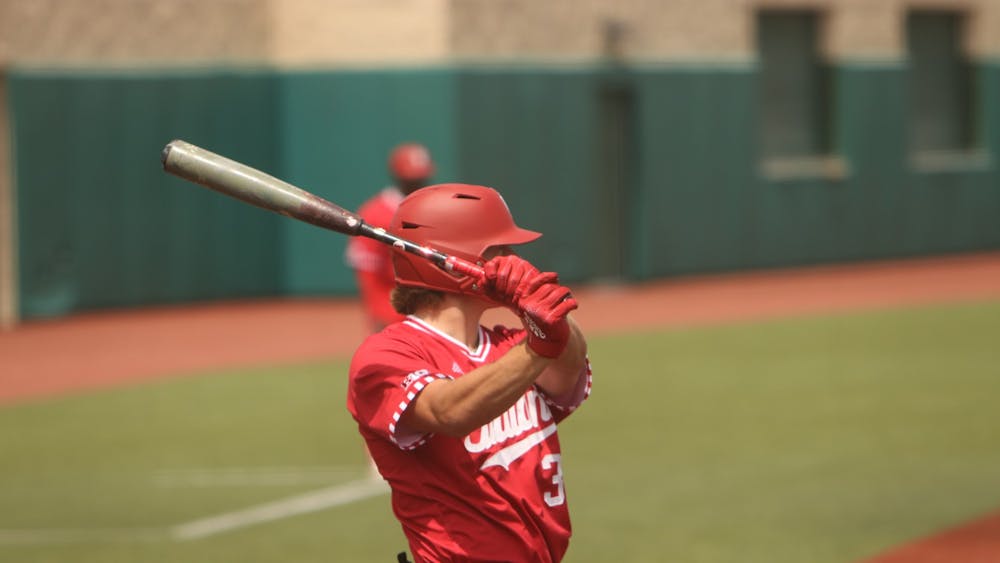 Freshman Carter Mathison takes a practice swing April 24, 2022, at Bart Kaufman Field. IU lost to Rutgers on Tuesday 2-14.&nbsp;