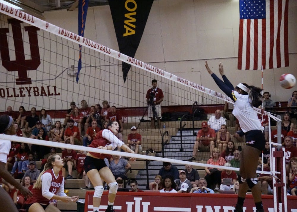 Freshman outside hitter Kamryn Malloy spikes the ball over a Maryland defender for a kill on Sept. 23. IU takes an 0-2 conference record into tonight's match at No. 13 Purdue.&nbsp;