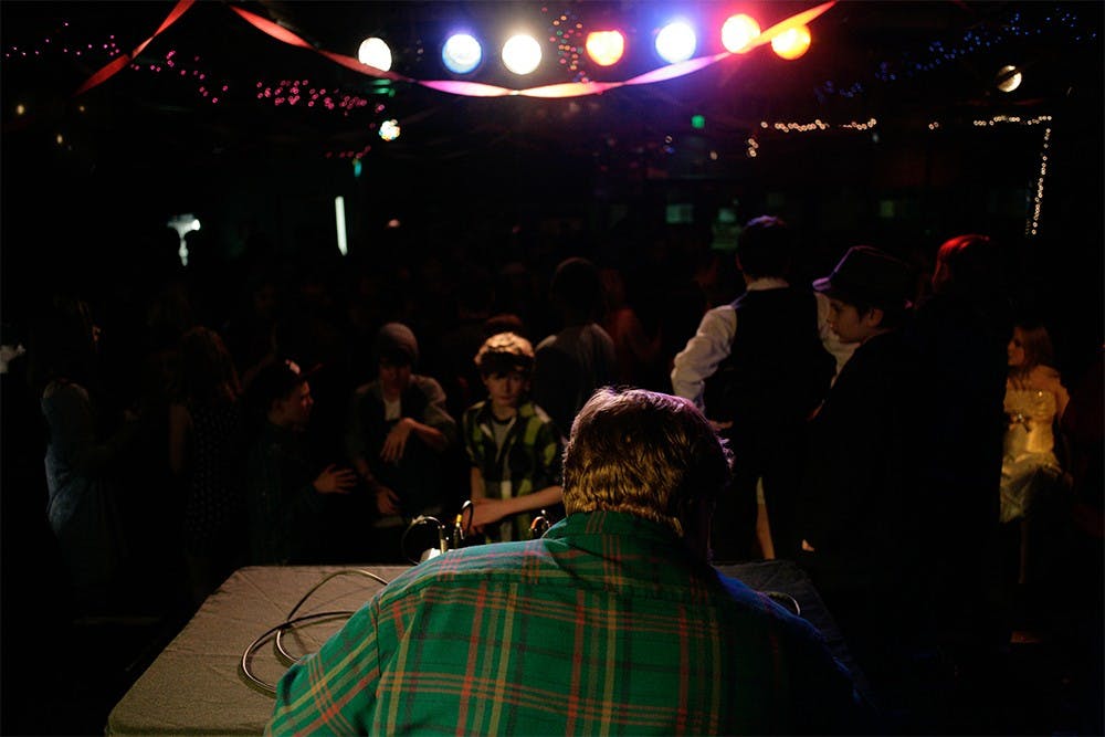 DJ Addison Lodgers plays music at Rhino Music CLub's event Chocolate Prom Saturday evening. "He's a local hero to us in the Bloomington community" said Eric Ayotte, a local musican and film maker.