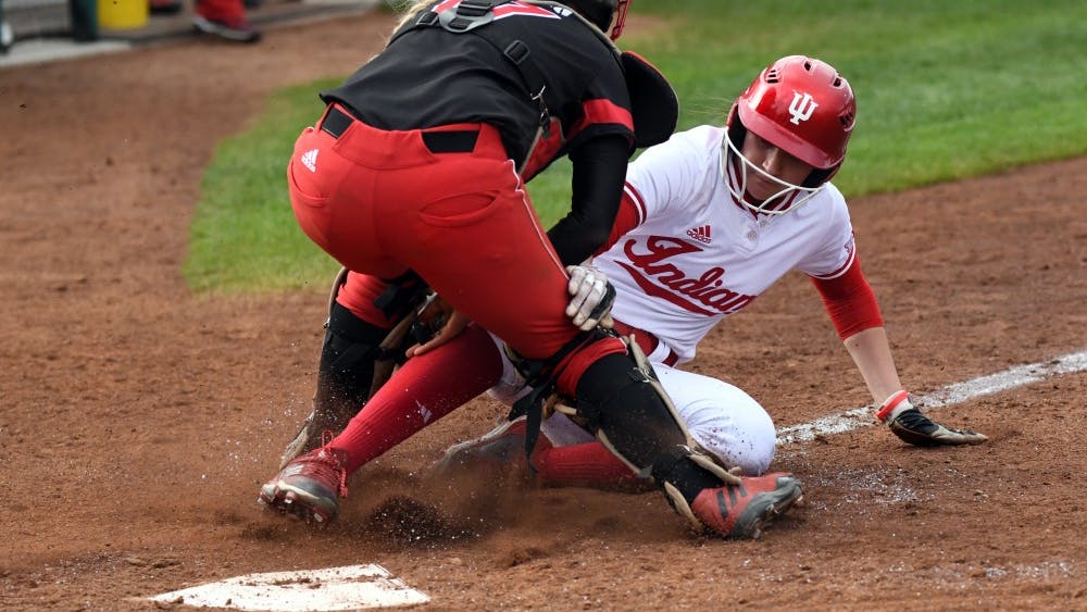 Then-freshman IU softball outfielder Taylor Lambert, now a sophomore, gets tagged out at the plate as she attempts to put IU's first points on the board April 18, 2018.&nbsp;