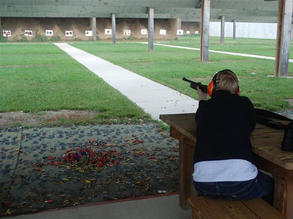 Meg Nickless, a master's student in counseling psychology, practices shooting Sept. 29 at Atterbury Shooting Range during Hunt, Fish, Eat. Participants in the Department of Natural Resources program learned skills necessary to catch and prepare their own food.