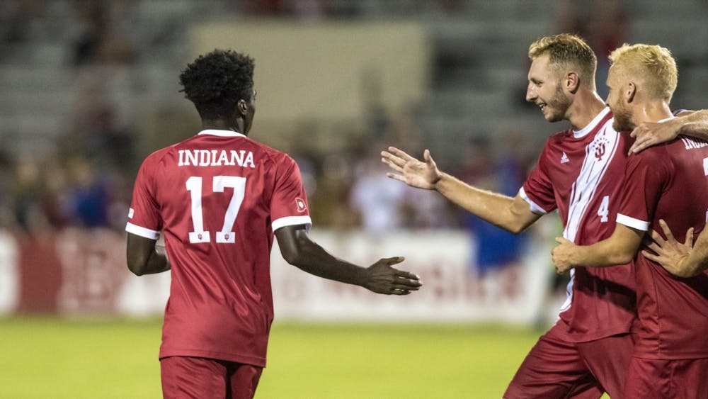 Then-senior Simon Waever, right, and redshirt then-junior A.J. Palazzolo, center, celebrate then-freshman Herbert Endeley’s, left, equalizing goal against the University of Notre Dame on Sept. 17, 2019, at Bill Armstrong Stadium. Indiana defeated Penn State 4-2 on Oct. 14, 2022.