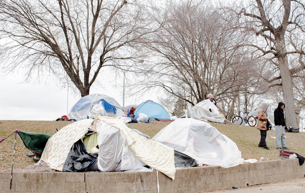 <p>Tents and other shelters are erected onDec. 8, 2022, at Seminary Square Park at 100 W. Second St. A new rule prohibiting tents and other enclosed structures in Bloomington public parks during the daytime went into effect Wednesday.<br/><br/></p>