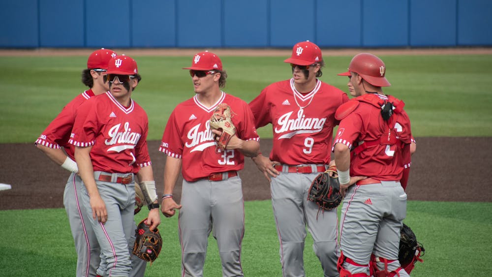 Members of the infield meet April 4, 2023, at Bob Warn Field in Terre Haute, during Indiana's game against Indiana State. Indiana will play in the Frisco College Baseball Classic in the 2024 season. 
