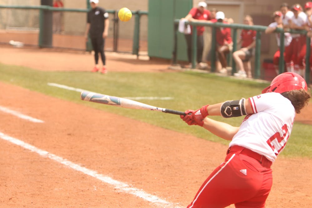 <p>Senior Julia Davis hits the ball April 24, 2022, at Andy Mohr Field. Indiana suffered a 0-3 sweep to No. 10 Northwestern at home this weekend.</p>