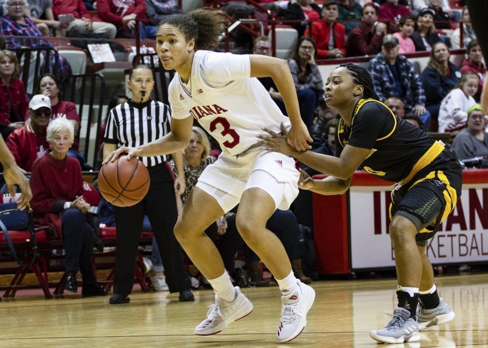 <p>Sophomore guard Jaelynn Penn drives to the basket as a defender grabs her waist during the Milwaukee game Nov. 7 at Simon Skjodt Assembly Hall. Penn scored 17 points against UCLA on Dec. 2 to lead IU to a 67-65 win.</p>