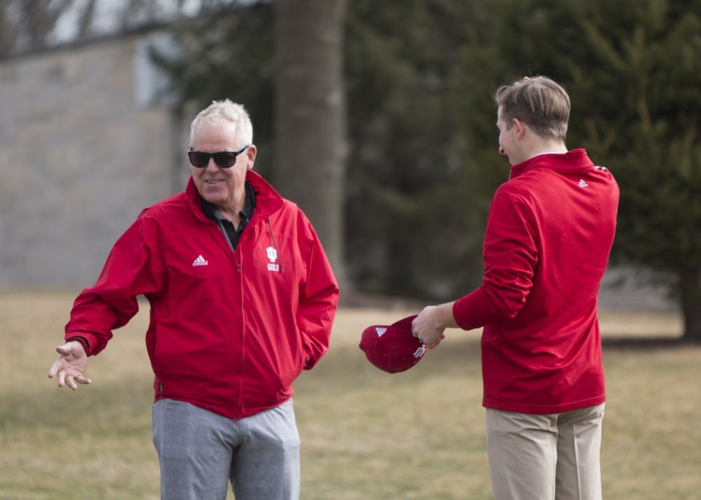 <p>Coach Mike Mayer talks to freshman Evan Yakubov during practice at the IU Golf Course in Jan. 2018. Mayer has been the head coach of IU men's golf for 21 seasons.&nbsp;</p>