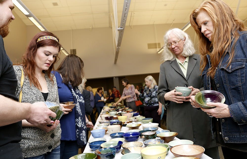 Participants choose bowls during a "22nd Annual Soup Bowl" event Sunday at Monroe County Convention Center. Local potters, IU Ceramics Guild, Ivy Tech-Waldron Ceramic Department, and stduents from Bloomington North High School made about 600 bowls. Participants could have bowls once they paid form the ticket. The event was hosted to fundraise Hoosier Hills Food Bank. 