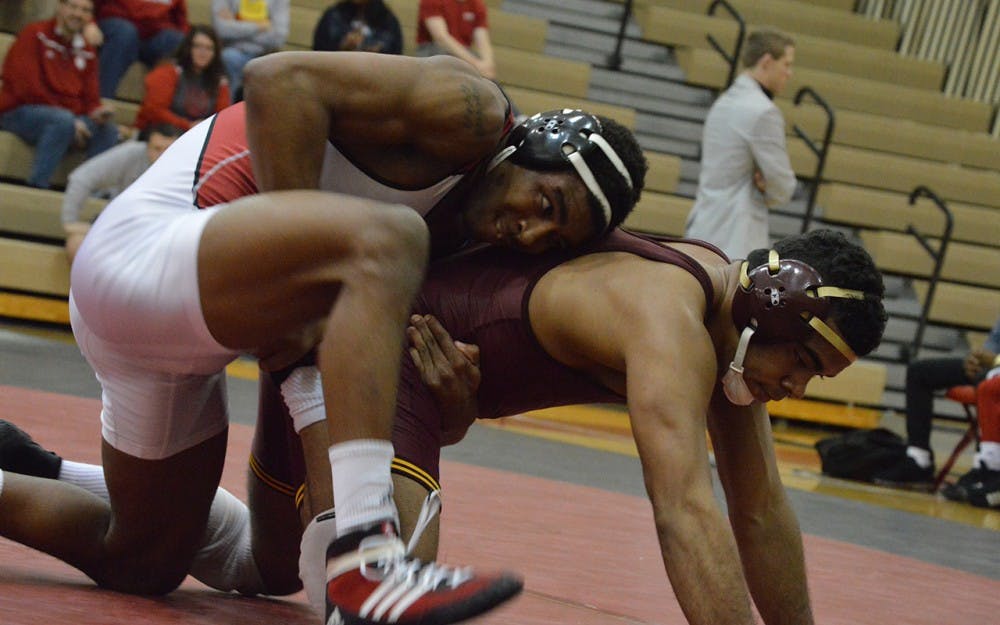 Senior Nate Jackson wrestles against Minnesota last Sunday afternoon in University Gym. Jackson, ranked No. 6 in his weight class, grabbed wins against both Maryland and Rutgers this weekend.
